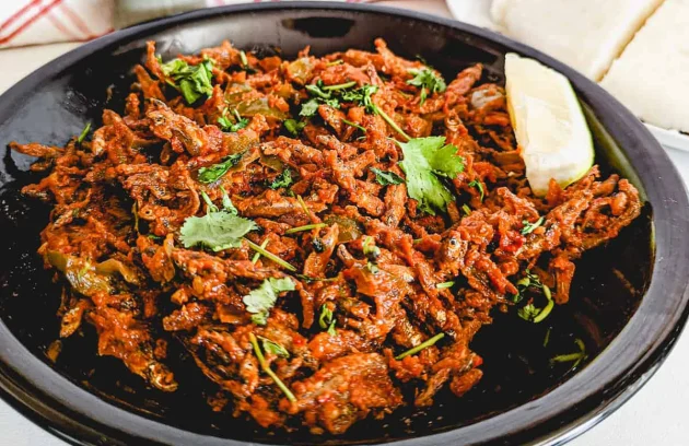 Omena (Dried Fish) with Kales and Tomatoes